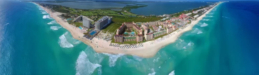 A panoramic view of the beach and hotel zone in Cancun, one of the top destinations featured in this Mexico travel guide.