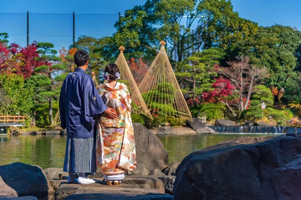 A couple in a traditional garden in one of Japan's wedding and honeymoon spots.